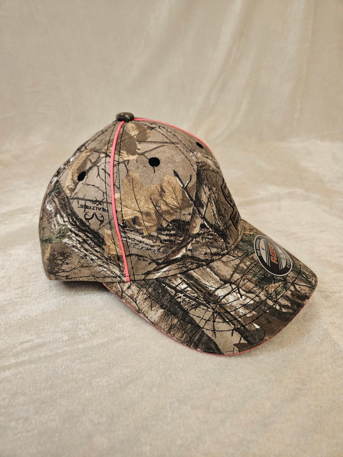 Women's camo Flexfit hat with pink piping, side