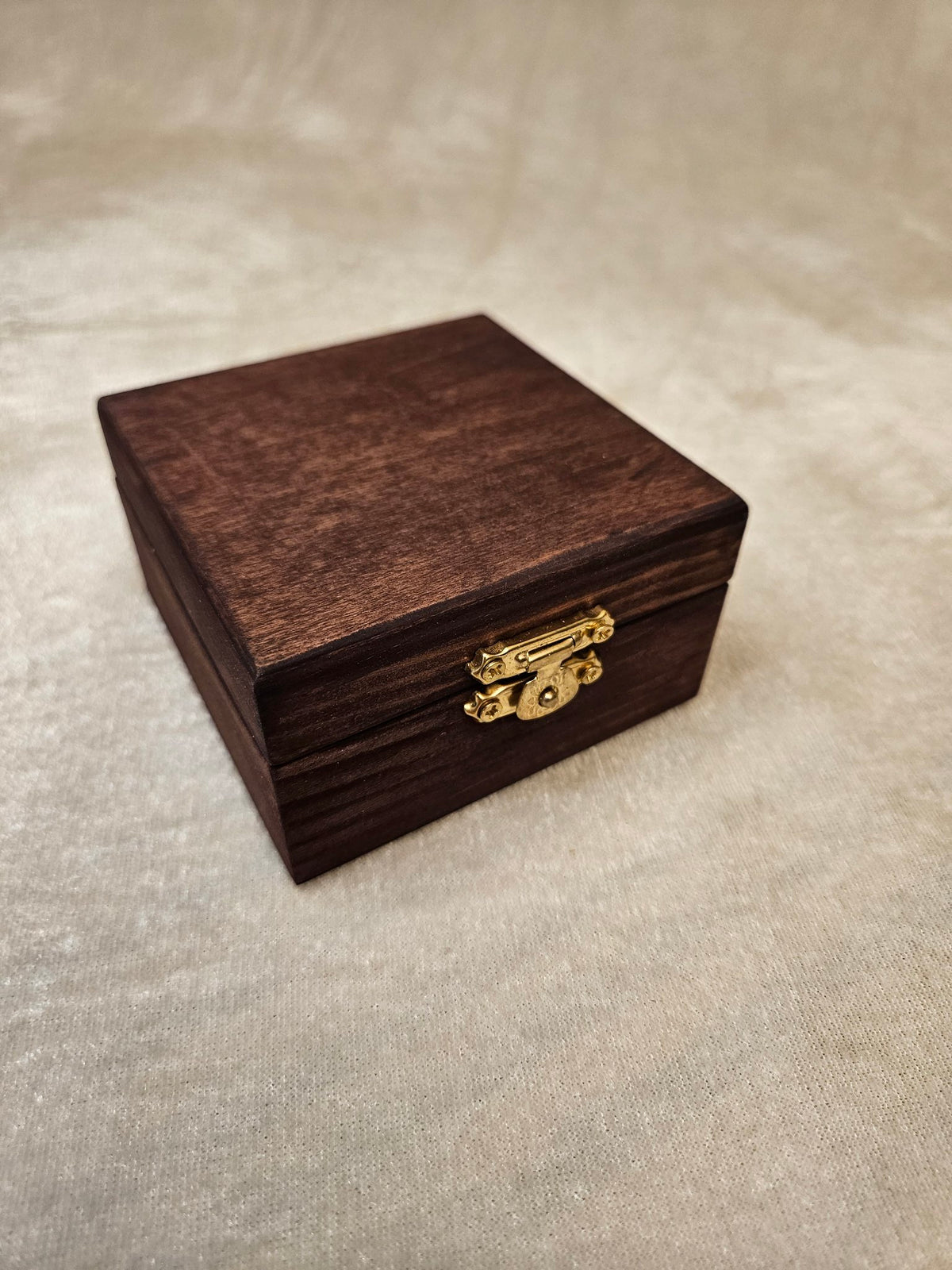 Handcrafted wooden skull box with velvet lining and brass latch