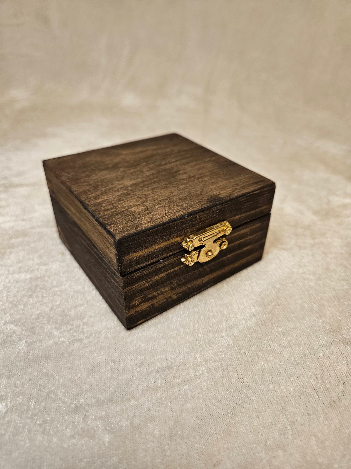 Handcrafted wooden skull box with velvet lining and brass latch