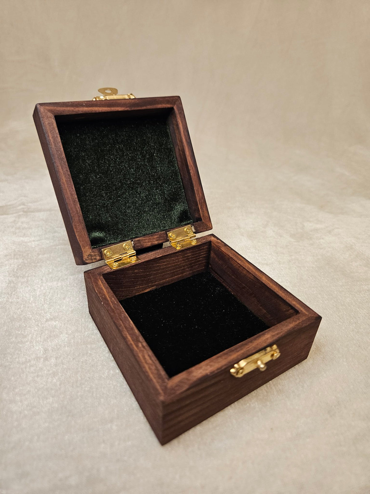 Handcrafted wooden skull box with velvet lining and brass latch