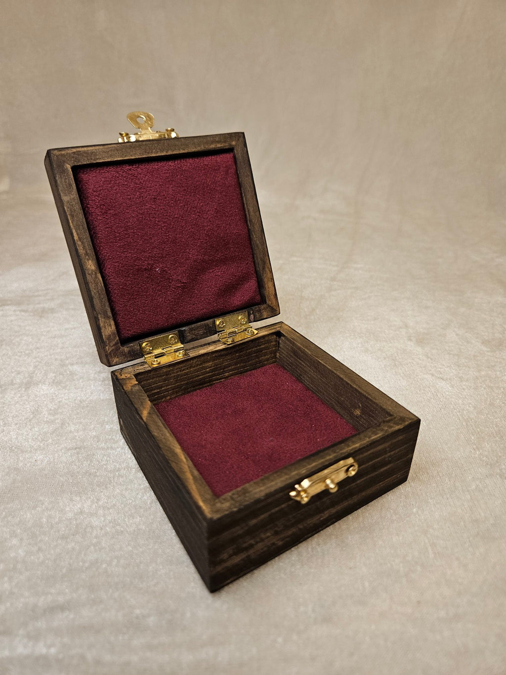 Handcrafted wooden skull box with velvet lining and brass latch