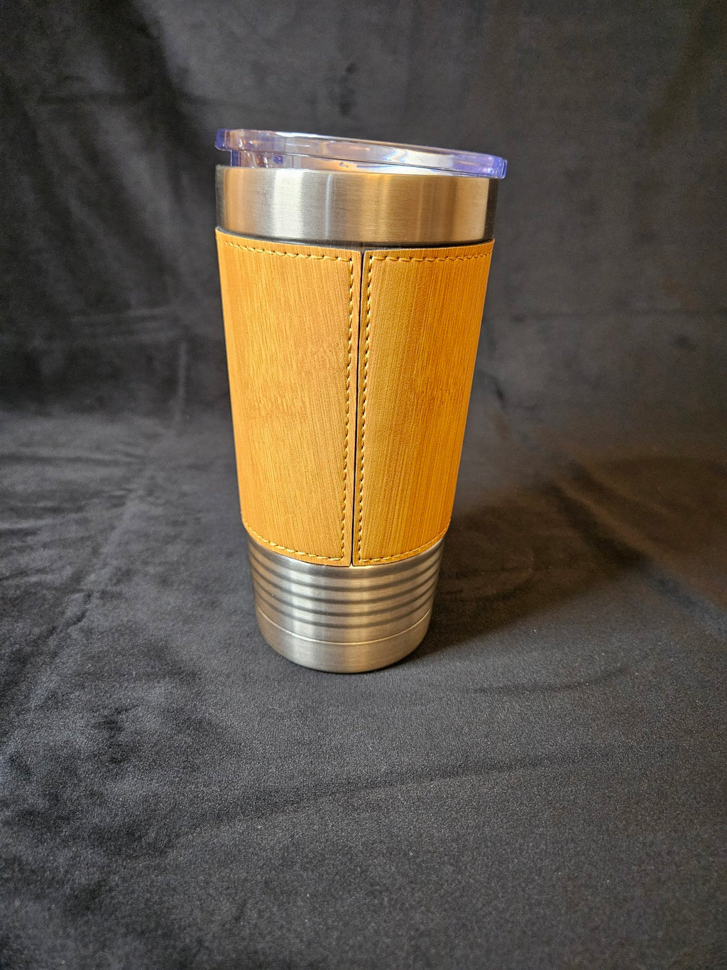 Tan leather-wrapped tumbler, back seam